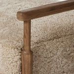 Detailed close-up of wooden armrest and top portion of front leg on Bennett Chair