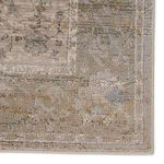 Tajsa Medallion rug lying under sofa and side table in a modern room with natural light