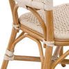 Close-up of chair’s lower back with curved rattan supports and rope bindings