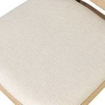 Detailed close-up showing cushion corner stitching and wood frame’s smooth finish