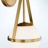 Polson sconce close-up angled view highlighting brass finish texture and globe opacity