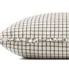Side view of pillow showing ruffled edges and thickness