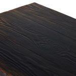 angled side view showing textured door panels, cabinet legs, and hand-applied worn finish