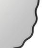 Lower left corner close-up emphasizing frame curve and smooth black finish