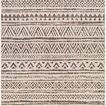 Black and white geometric pattern rug with alternating triangles and diamond shapes in flat weave style