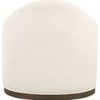 Rear view showing rounded ivory fabric back and dark wood trim base of the swivel chair