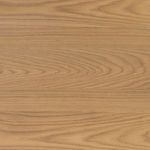 Close-up overhead view of burnished oak wood grain pattern on Armstrong Desk tabletop