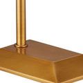 Close-up of floor lamp base, showing clean lines and brushed antique brass finish