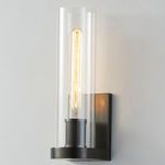 Angled side view of illuminated sconce against light gray wall