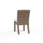 Havana Armless Dining Chair shown from back highlighting woven wicker texture and chair legs