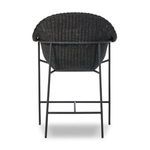 Close-up of arm curve with woven texture coupled with black woven seat cushion