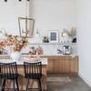 Two Lewis Windsor Bar + Counter Stools in kitchen setting with wooden cabinetry and marble backsplash