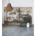Valencia Beaded Chandelier hanging near tropical mural with large leaf in white vase on floor