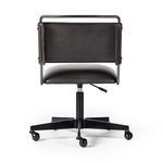 Tight focus on side curve of padded seat and backrest panel stitching details