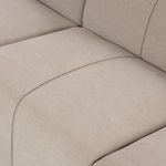 Detailed view of channel stitching on seat cushion with visible texture of woven fabric
