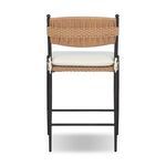 Rear view highlighting woven backrest curve and tied cushion attachments