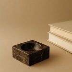 Brown Emperador Square Bowl styled on beige surface next to closed books, showing room context