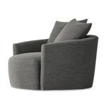 Tight fabric close-up focusing on upholstery texture and two overlapping pillows