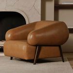 Devlin chair styled in living room with fireplace and neutral decor on beige rug