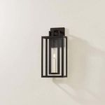 Amire sconce mounted on wall showing shadow and installation context on light-colored wall