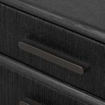 Close-up of long horizontal drawer handle on ribbed textured front