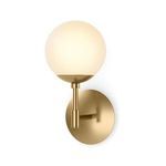 Sunset Sconce illuminated softly on white wall with globe glowing evenly in warm light