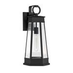 Close-up side view of matte black outdoor lantern revealing slim tubular bulb and geometric detailing
