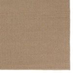 Detailed look at woven herringbone pattern texture at one rug corner
