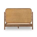 Back view of bed highlighting the plain wood panel behind the upholstered headboard