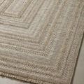 Close-up of another rug corner emphasizing detailed rectangular pattern and neutral tones