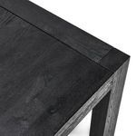 Close-up of tabletop corner displaying natural oak wood grain and precise joinery