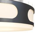 Close-up of black metal frame cut outs and milky white glass illumination on Swale Outdoor Flush Mount
