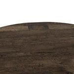 Close-up top view of table surface showing wormwood oak grain and dovetail joinery details