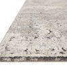 Side angle showing low profile edge and plush texture of Theory Grey / Sand Rug