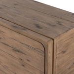 Close-up of chamfered drawer edges and seamless framing joinery at top side corner