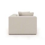 Back view of the sofa corner wedge showing plain upholstery and boxy silhouette