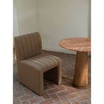 Sally Dining Chair near round marble and wood table in bright room with terracotta floor and white walls