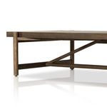 Close-up emphasizing the diagonal wood support beams and rounded wood legs