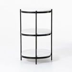 Bottom shelf close-up showing smooth polished marble and black iron frame legs