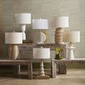 Group of seven table lamps including Linz with white base arranged on rustic wood benches