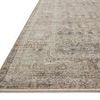Close-up side angle of rug edge showcasing low pile and muted pattern detail