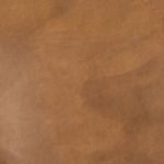 Close-up of leather surface showing patina coloration and natural leather grain