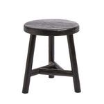 Benji Stool handcrafted from dark stained wood with a round top and three angled legs connected by a triangular stretcher