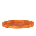 Large round serving tray in vibrant orange resin with smooth glossy finish and raised edges