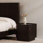 Close-up side angle with ceramic vase decor on tray top near bedroom wall