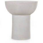 Close-up front view of the rounded bowl top of the matte white end table