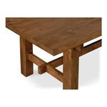 Close-up detail of table leg and crossbeam showcasing pine wood texture and finish