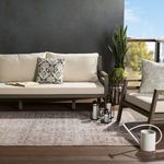 Close-up showing rug texture and soft color transitions under ambient sunlight and shadows over lantern