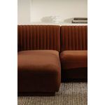 Close-up on seat and back junction from the left side, highlighting deep channel tufting and soft velvet finish