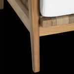 Close-up of lower teak leg and resin wicker wrapping detail under seat